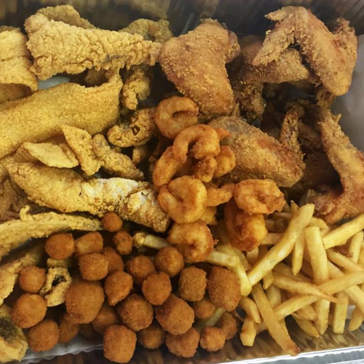 Chicken wings, french fries, fish, and shrimp from Big JJ Fish and Chicken.