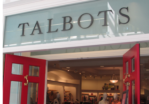 Exterior phone of Talbots featuring their sign and red doors.