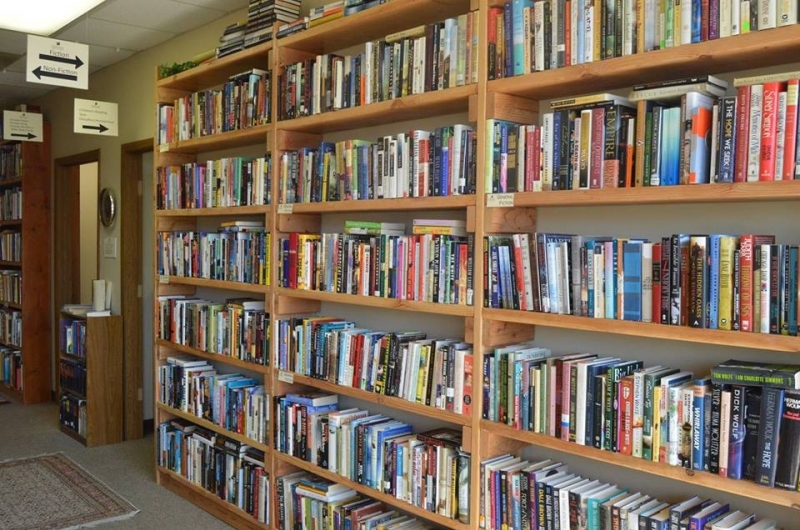 Rows of bookshelves at Orphans Treasure Box.
