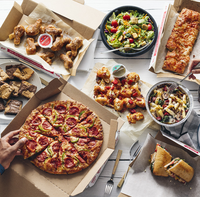 Pizza, garlic knots, pizza, salad, and cheese sticks from Domino's.