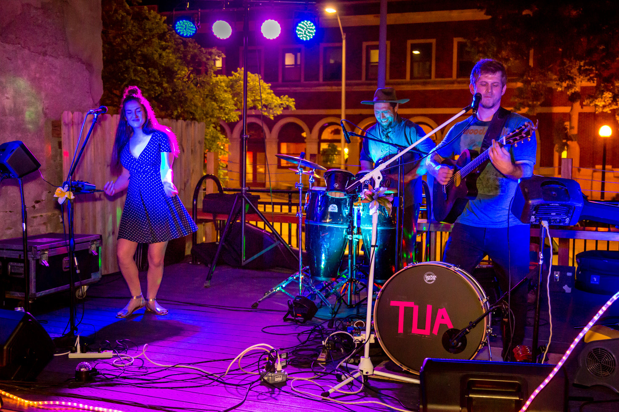 Band performing outside at Pour Bros in Downtown Champaign