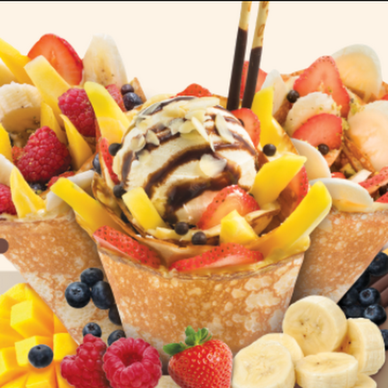 Crepes with strawberries, pineapple, vanilla ice cream, and chocolate sauce from Paris Super Crepes