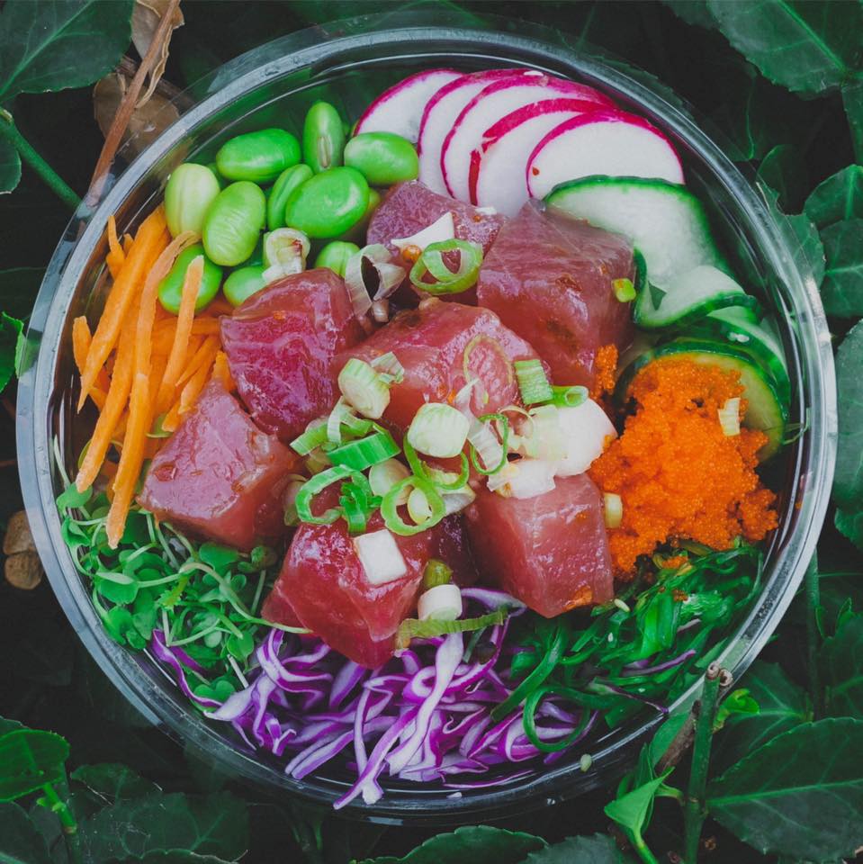 Poke bowl with mixed greens, tuna, beats, carrots, and edamame.