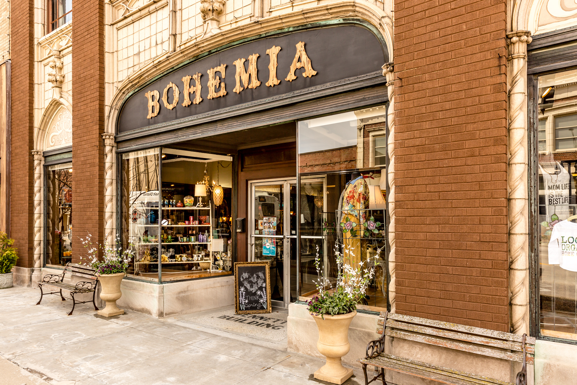 brick storefront with window and the store name Bohemia