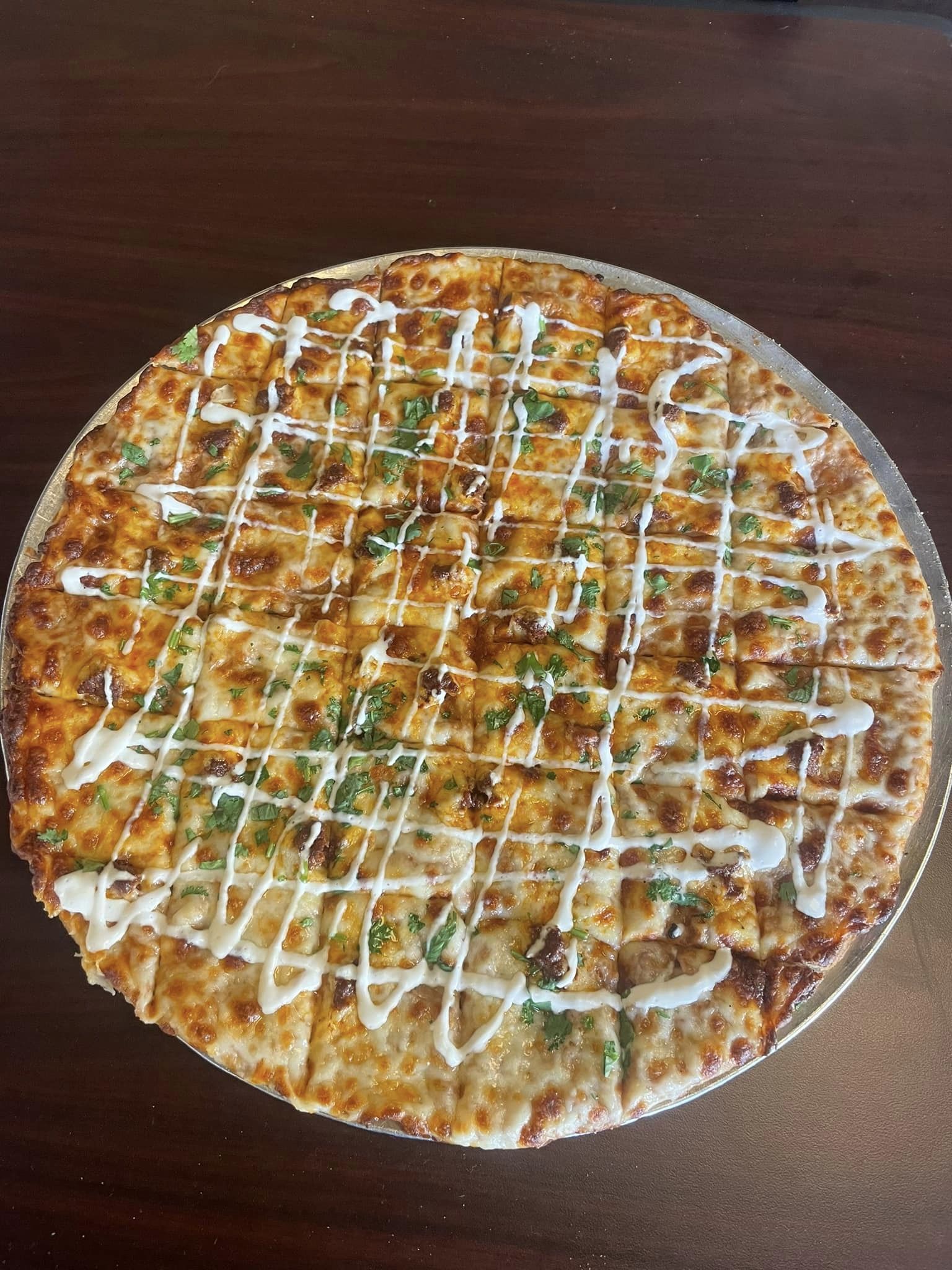 thin crust pizza with sausage and ranch dressing