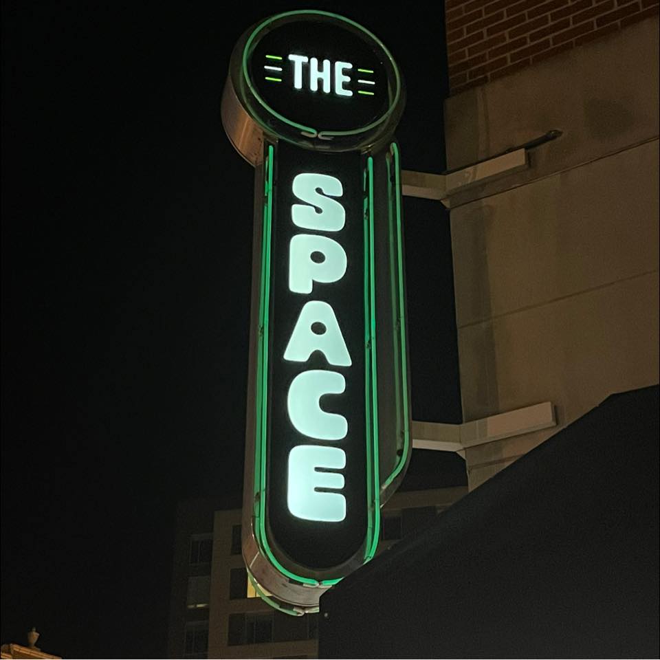 Outside sign of The Space in Downtown Champaign
