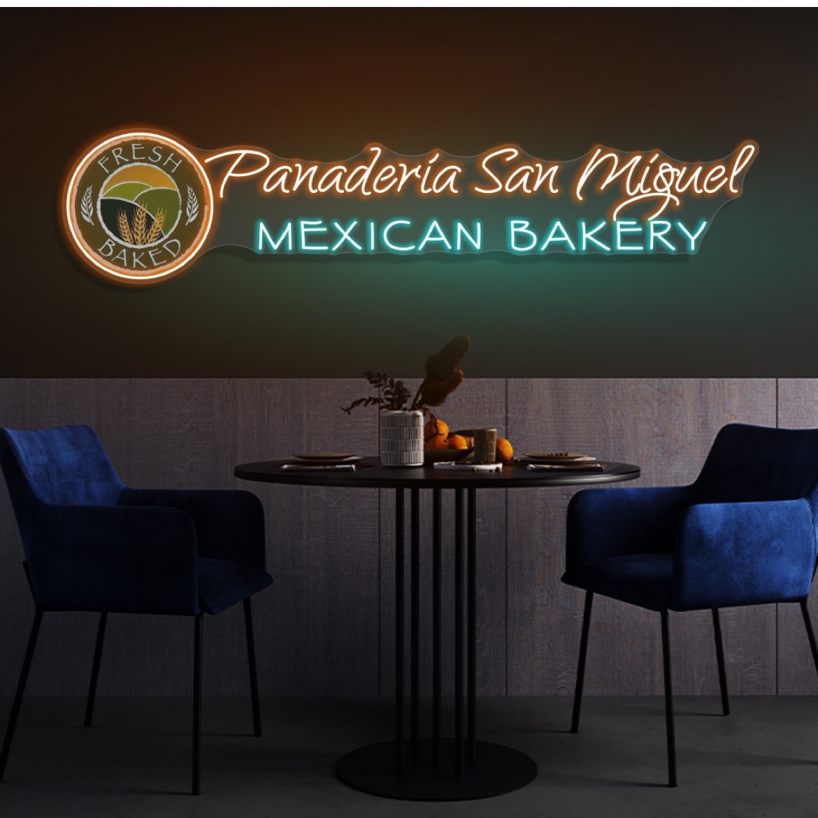 Neon sign for Panaderia San Miguel Mexican Bakery and two blue chairs and a table.