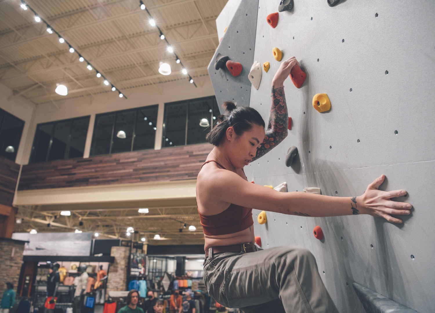 Customer climbing the rock wall at Dick's House of Sport.