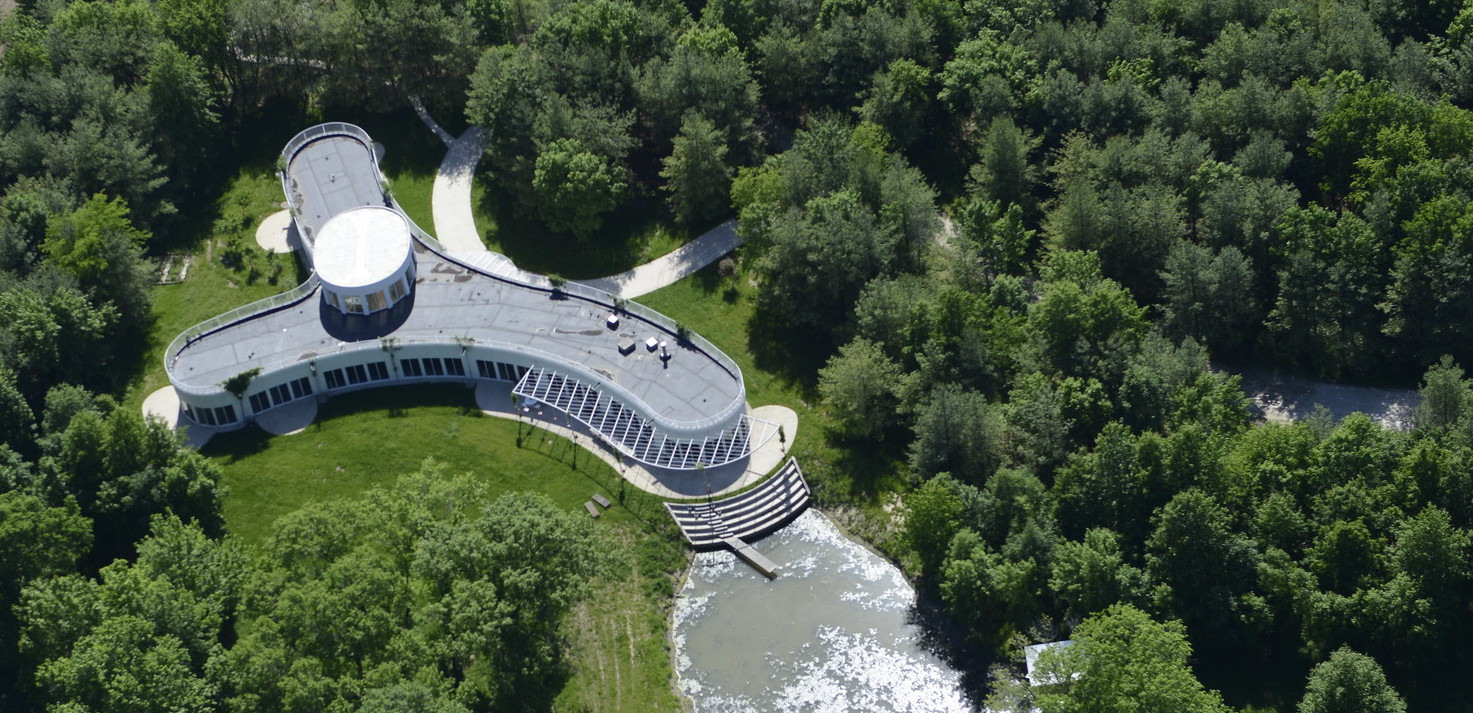 Overhead view of a Y-shaped white structure surrounded by trees