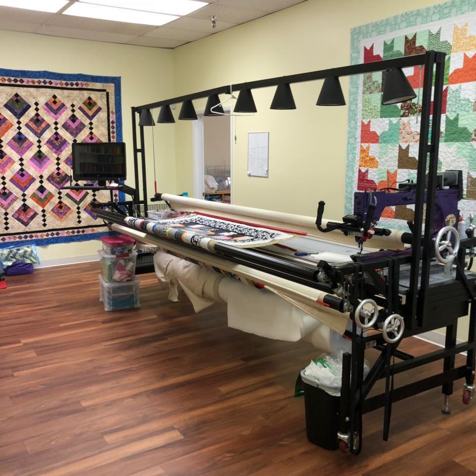 Machine making a quilt at Everyday Quilting Company.