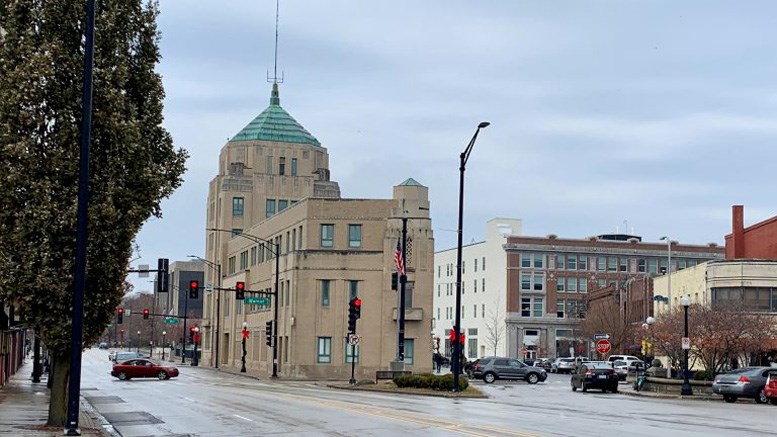 street with tan brick city building
