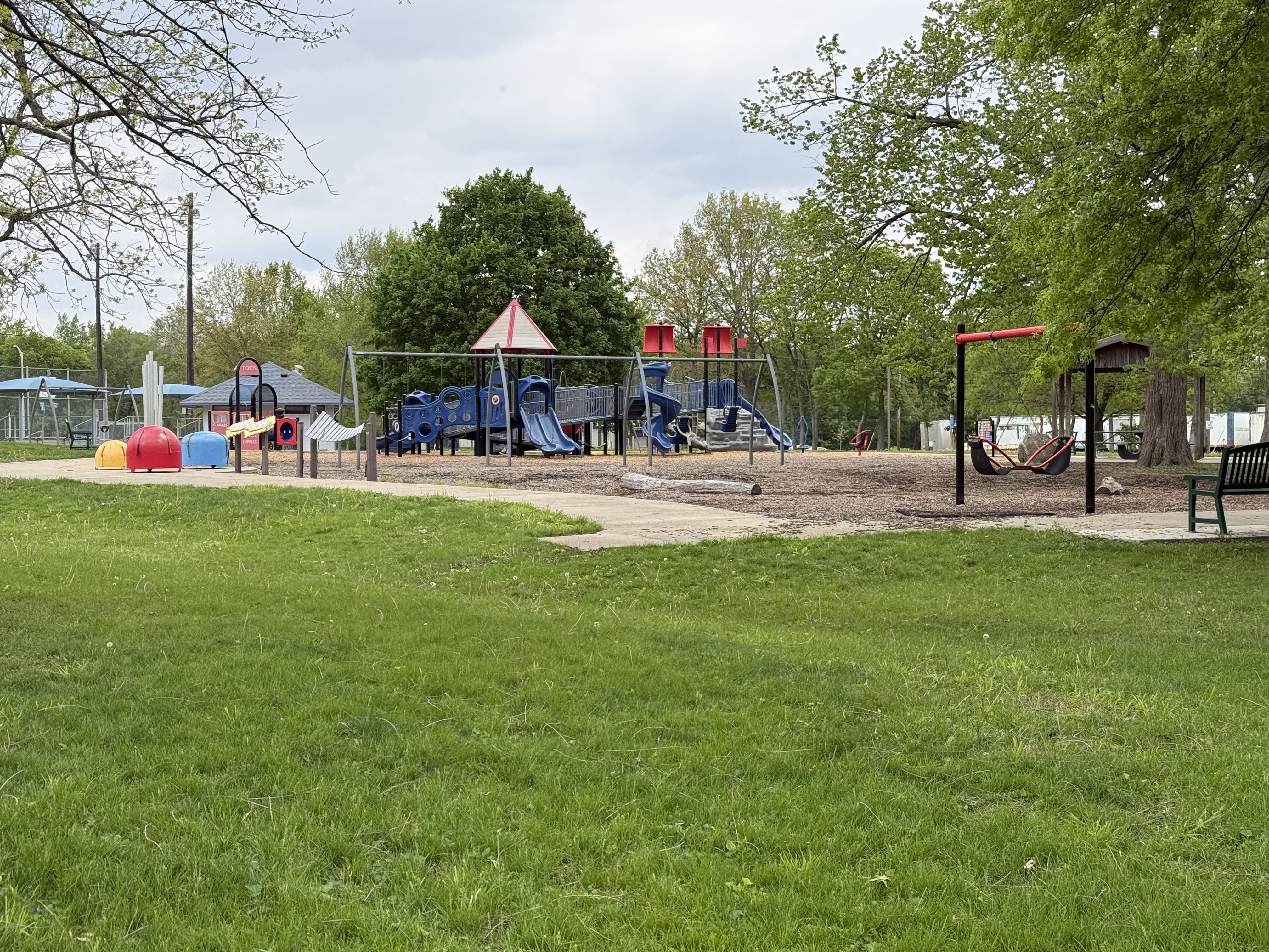 colorful playground with grass in front