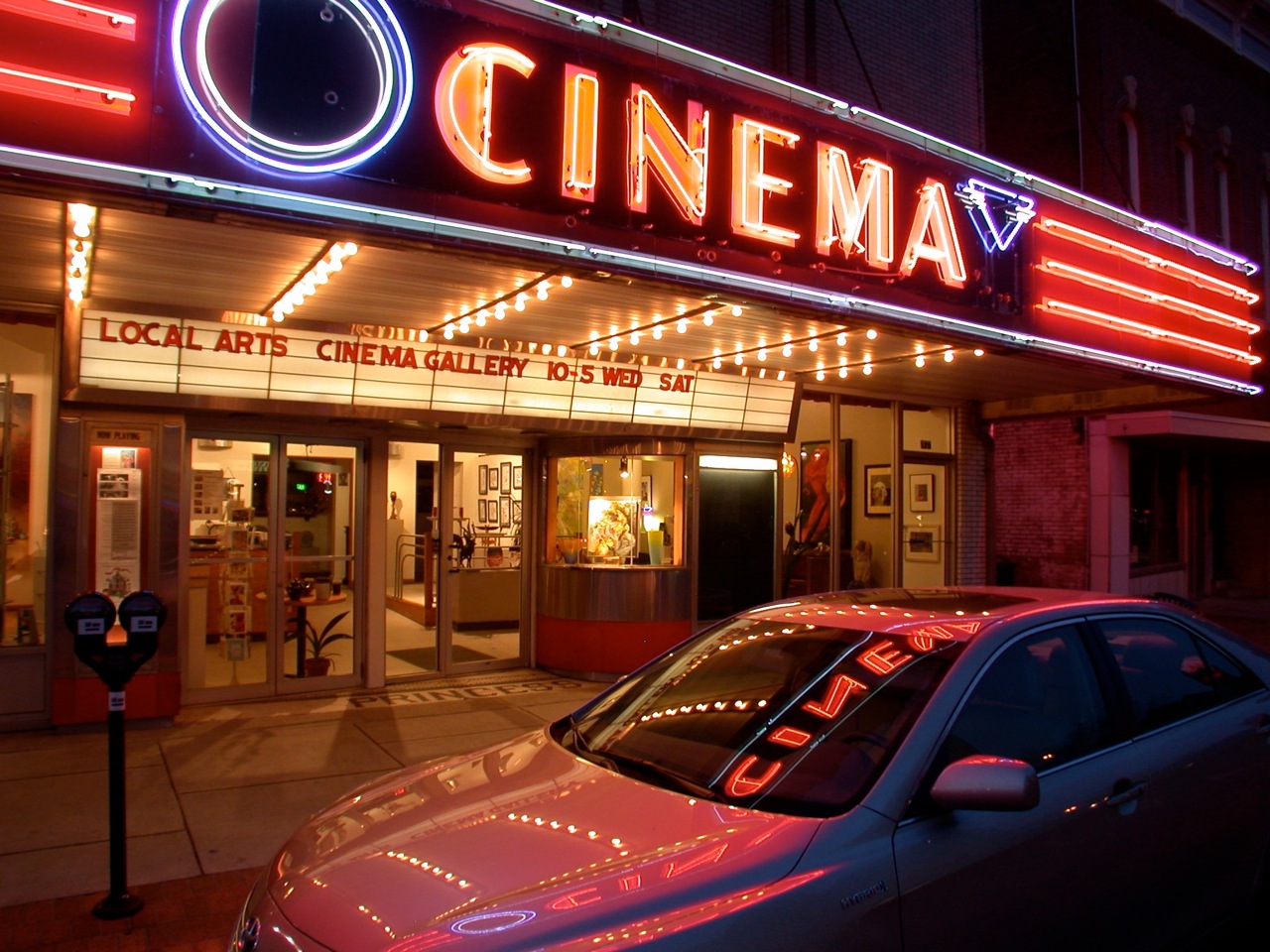 cinema sign with neon lights at night