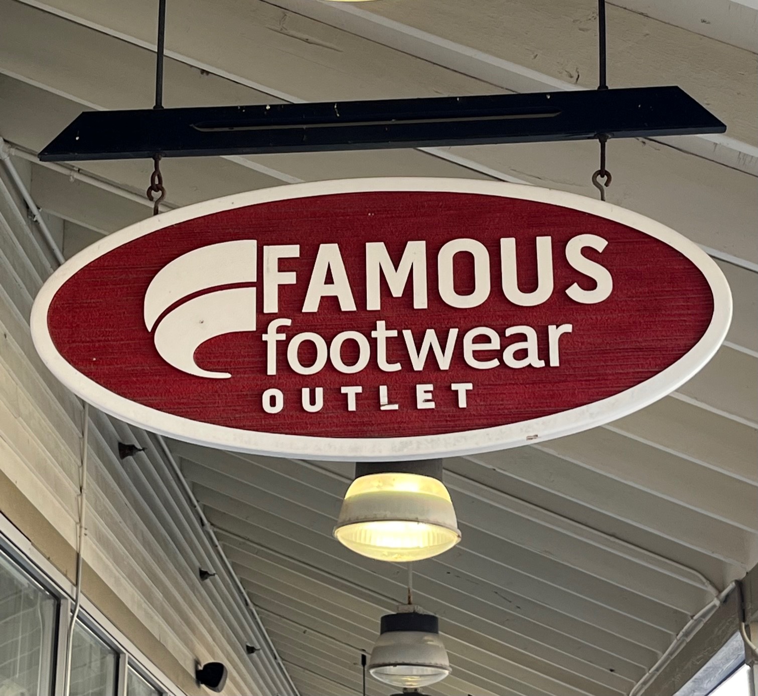 Sign for Famous Footwear Outlet in Tuscola.
