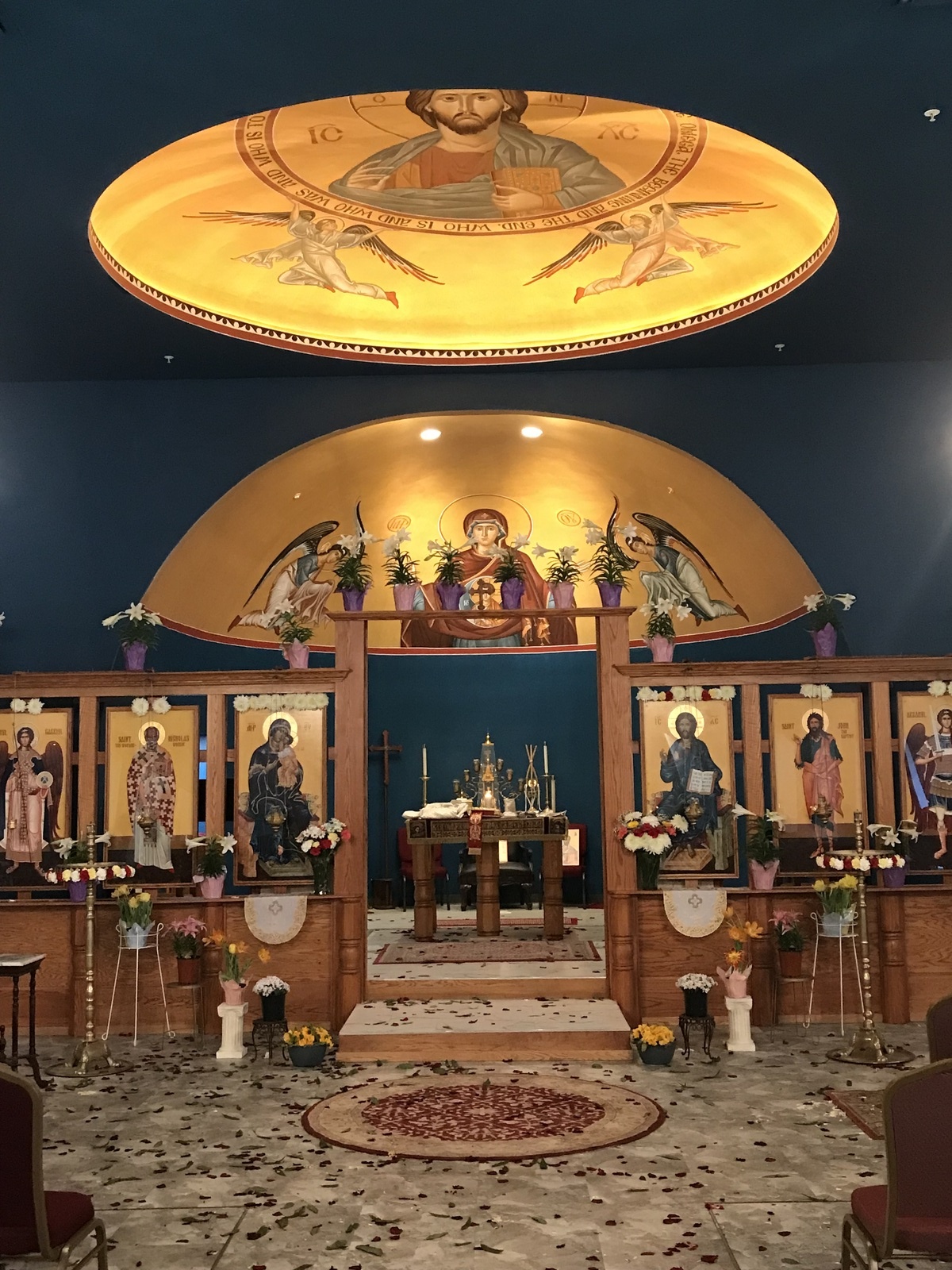 Church alter with iconography and blue and gold coloring