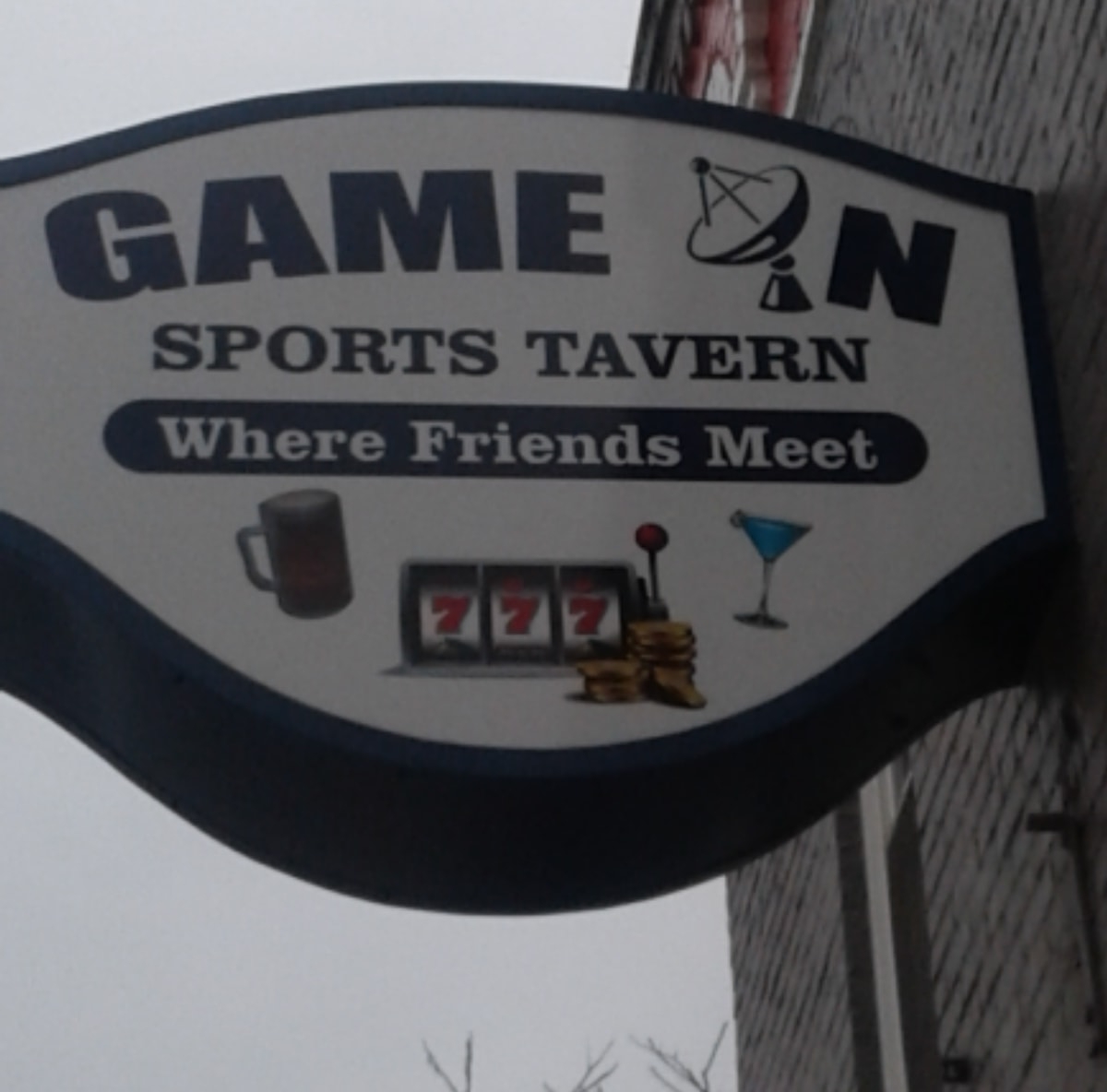 Sign on side of building for Game On Sports Tavern.