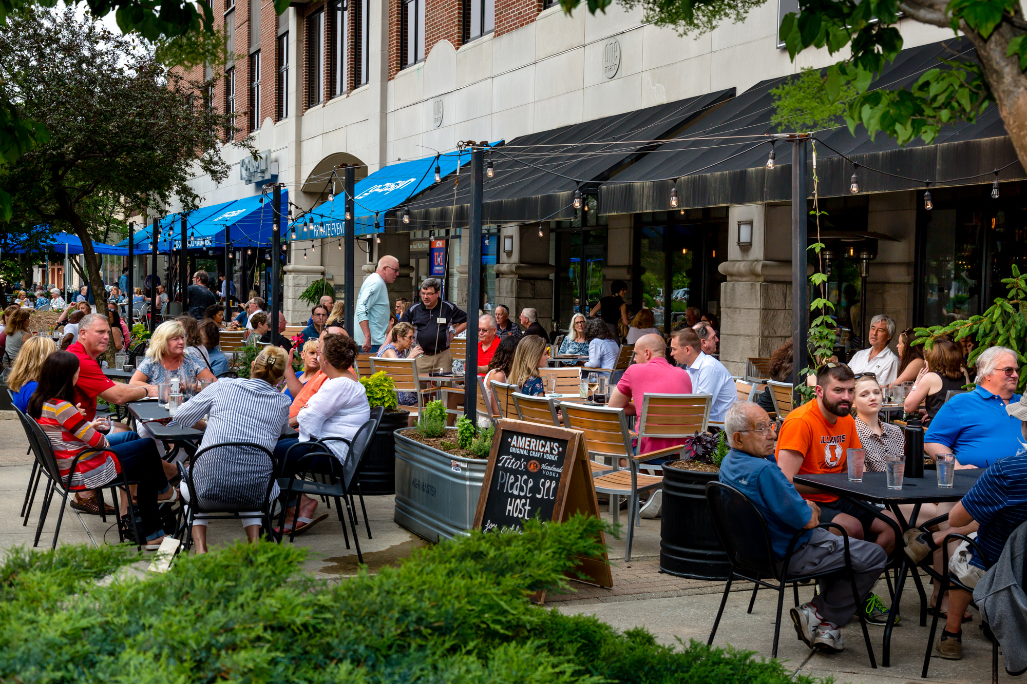 Customers eating outside at Big Grove Tavern.