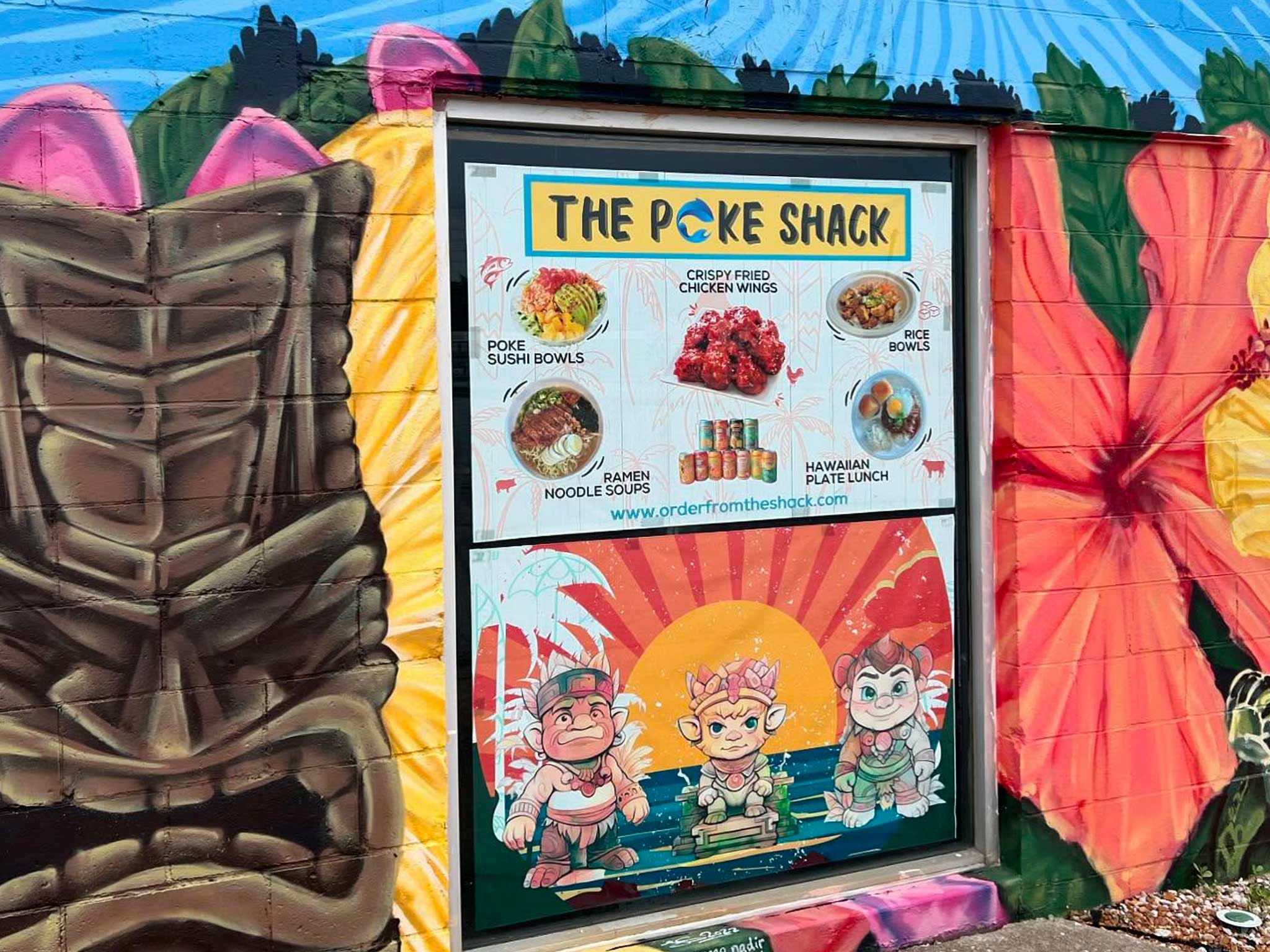 Colorful Hawaiian mural on the outside of restaurant building