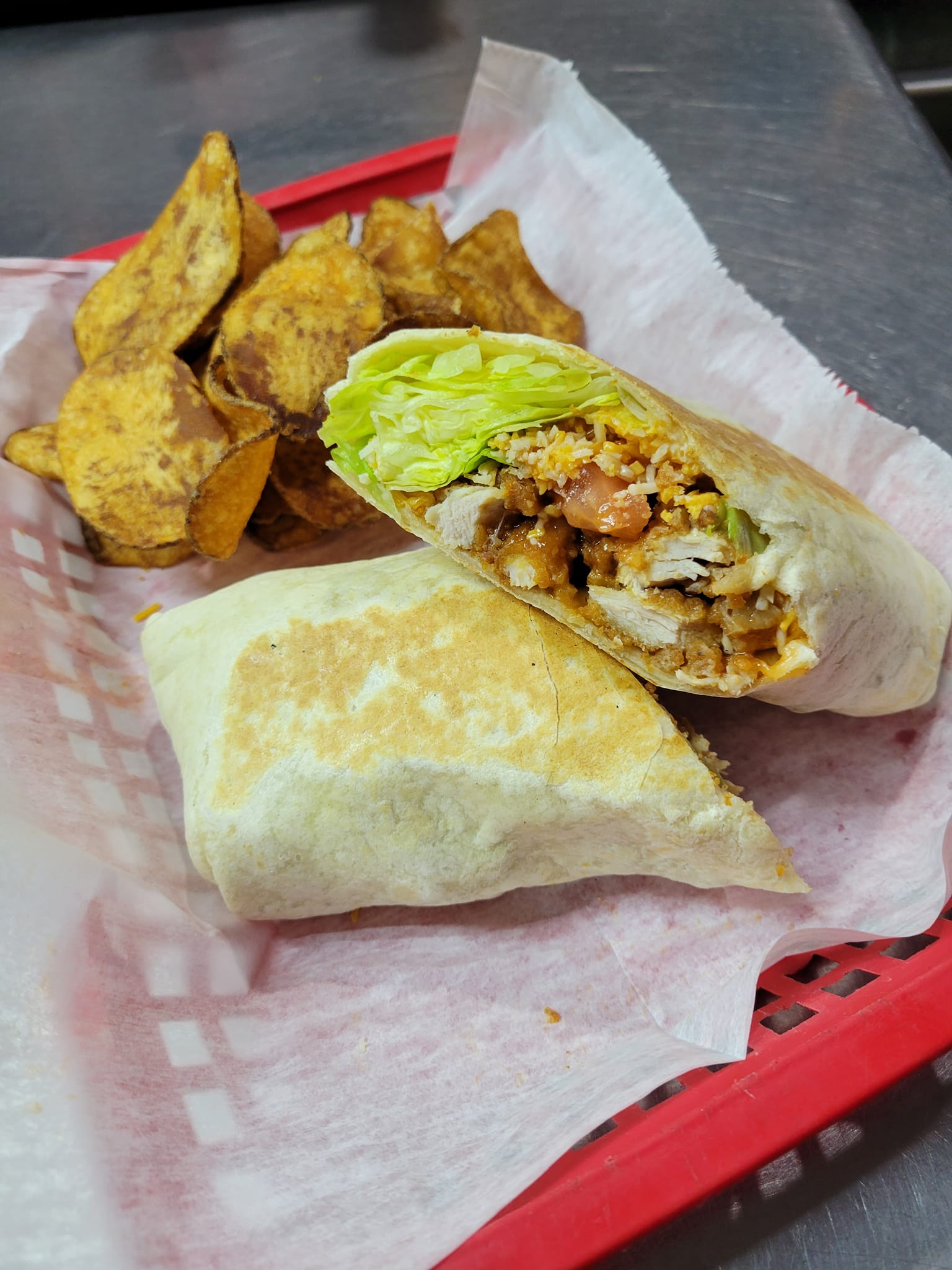 Buffalo chicken wrap and homemade chips from Pia's Sports Bar & Grill.