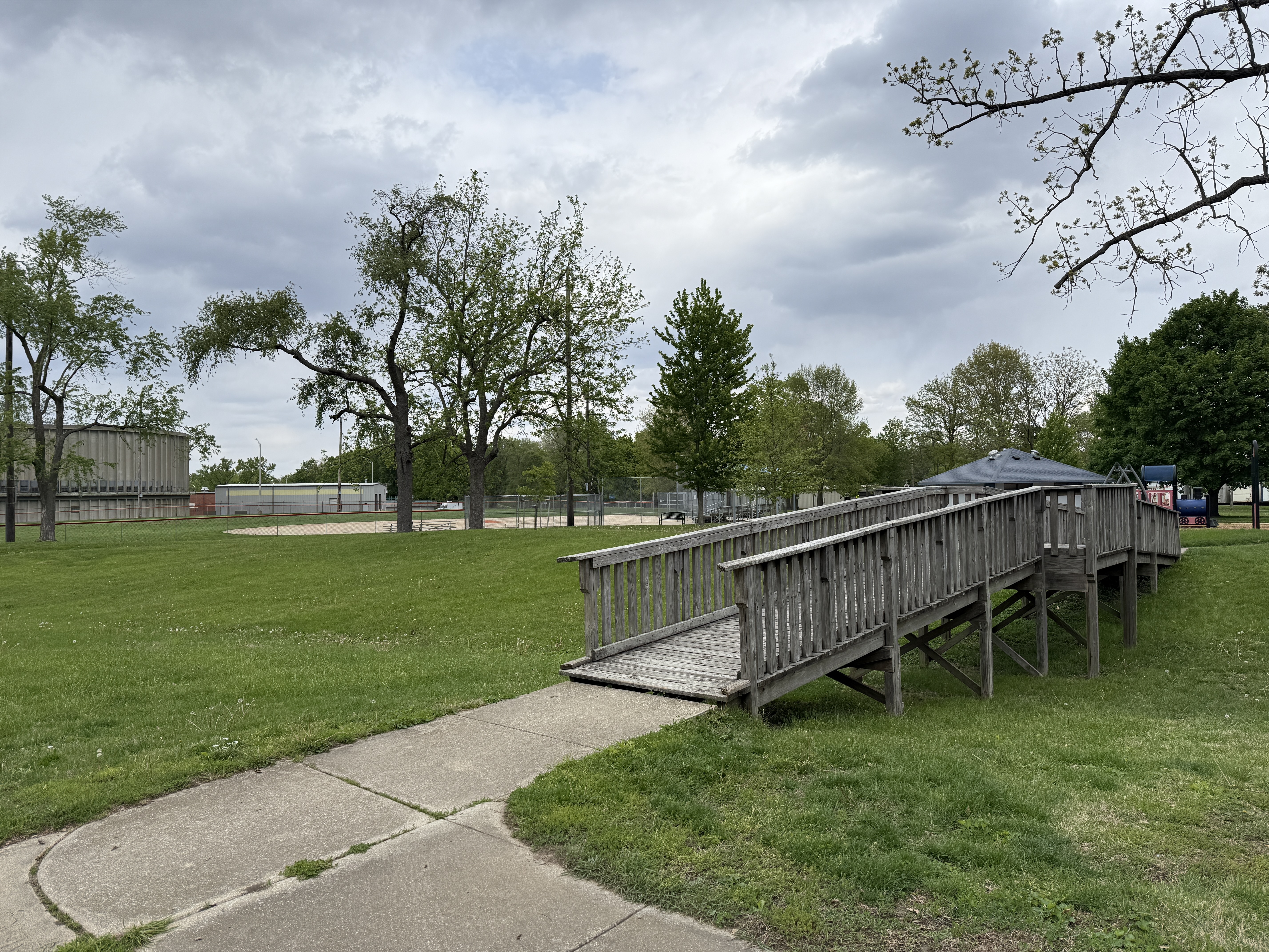 wooden bridge over grass