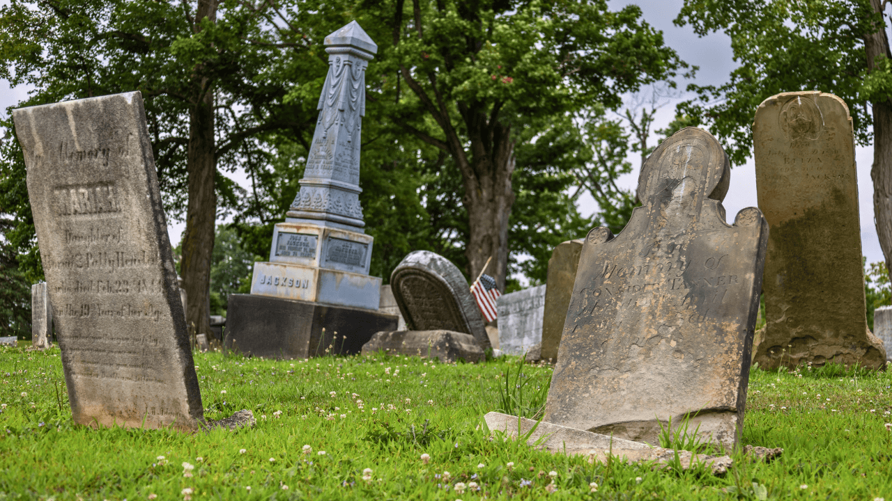 19th-century headstones and an obelisk monument at Evergreen Cemetery in Johnston Township, Trumbull County, Ohio, one of Northeast Ohio’s earliest pioneer burial sites.